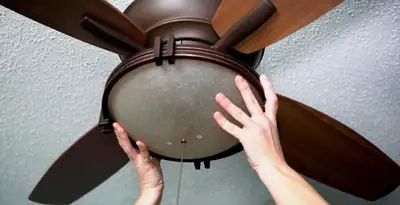 Ceiling fan repair and reinstallation on ceiling mount in Green Bay, WI