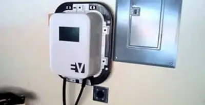 Electric car charger installation with wall-mounted EV charging station in Green Bay, WI