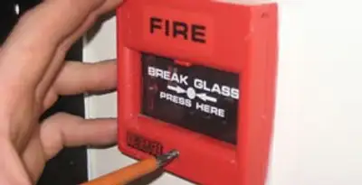 fire alarm installation service showing manual fire alarm pull station installed by licensed electricians in Green Bay, WI