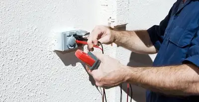 Electrician performing home electrical outlet and wiring inspection in Green Bay, WI