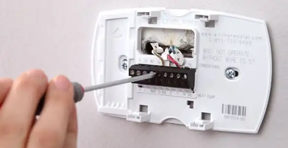 Thermostat installation service with proper wiring and secure wall mounting in Green Bay, WI