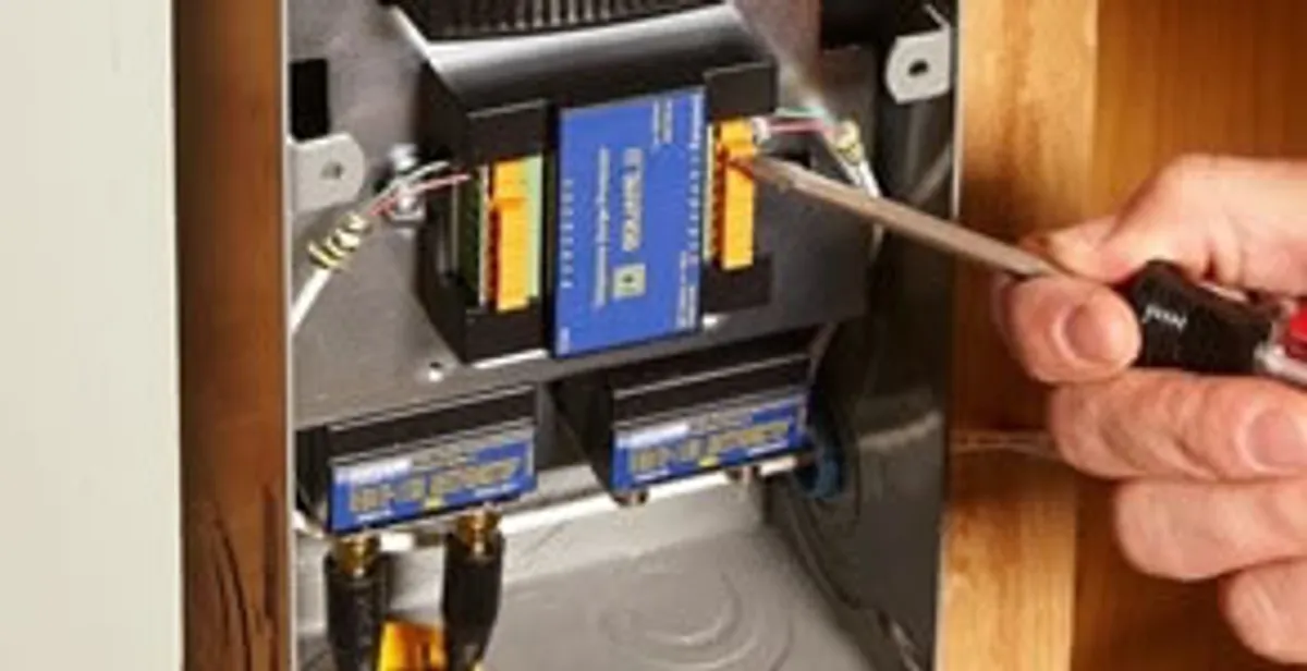 Whole home surge protection device being installed by a licensed electrician to protect electrical systems in Green Bay, WI